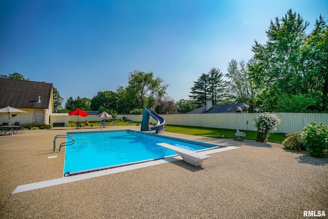 241 Birch Pl, Kewanee, IL 61443 - view of pool with a water slide, a patio, and a diving board