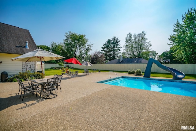241 Birch Pl, Kewanee, IL 61443 - view of pool featuring a water slide, a patio, and a fenced backyard