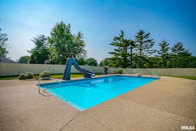 241 Birch Pl, Kewanee, IL 61443 - view of pool featuring a water slide, a fenced backyard, and a patio area