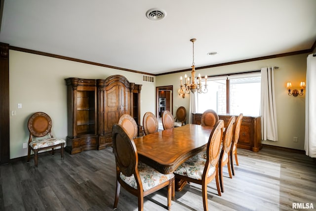 241 Birch Pl, Kewanee, IL 61443 - dining room with a chandelier, wood finished floors, and crown molding