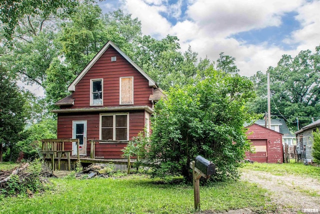 7113 S Depot St, Bartonville, IL 61607 - rear view of house with a deck and an outbuilding