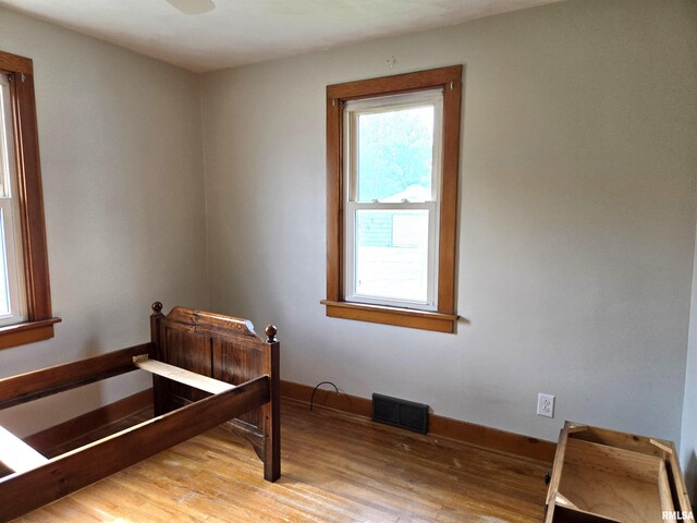 904 E Elm St, Canton, IL 61520 - bedroom featuring light wood finished floors and baseboards
