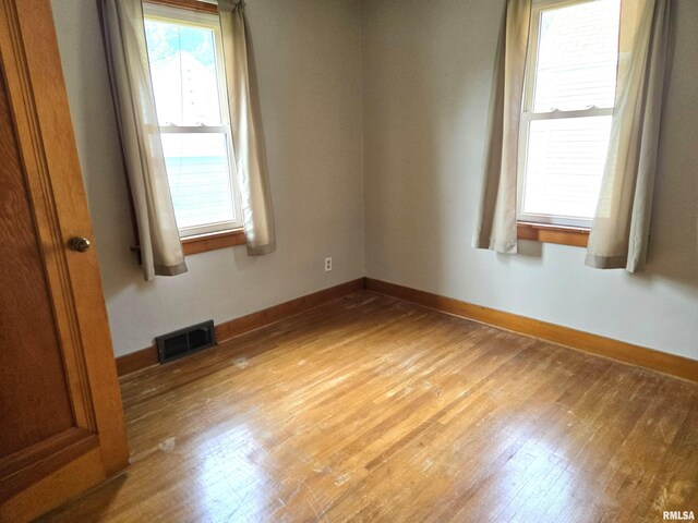 904 E Elm St, Canton, IL 61520 - spare room with light wood-style floors and baseboards