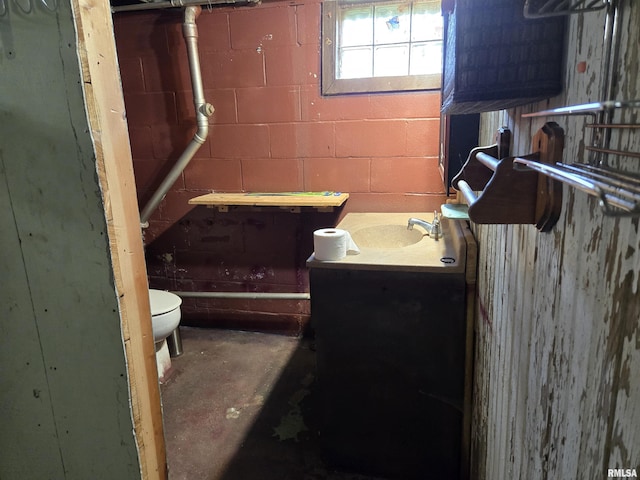 904 E Elm St, Canton, IL 61520 - half bath with vanity and concrete floors
