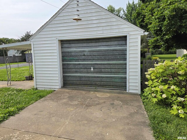 904 E Elm St, Canton, IL 61520 - garage with a garage and concrete driveway