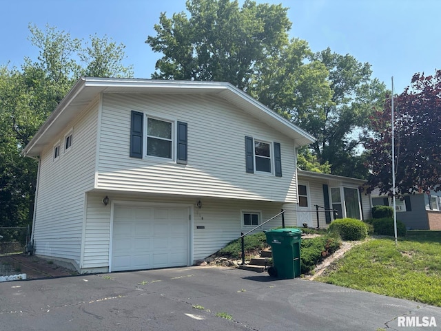 218 W Kurlene Dr, Macomb, IL 61455 - view of front facade featuring an attached garage and driveway