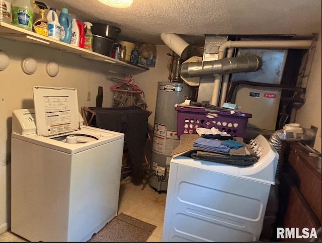 218 W Kurlene Dr, Macomb, IL 61455 - washroom featuring gas water heater, washer and dryer, and a textured ceiling