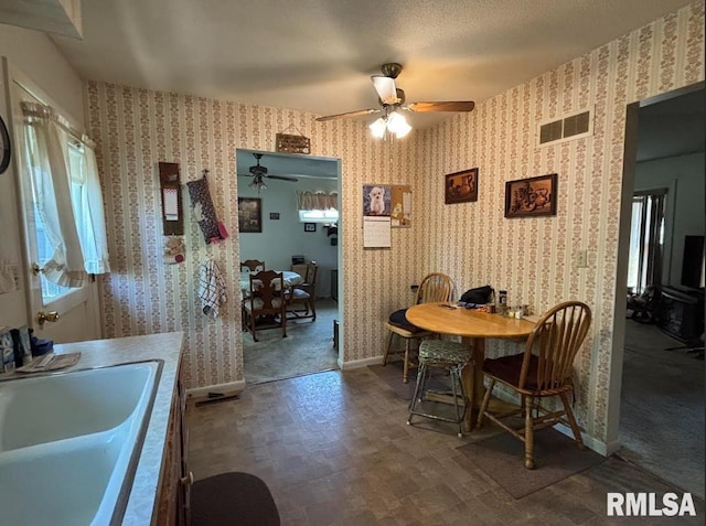 218 W Kurlene Dr, Macomb, IL 61455 - dining area featuring wallpapered walls and ceiling fan