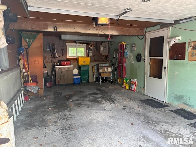 218 W Kurlene Dr, Macomb, IL 61455 - garage featuring a garage door opener and water heater