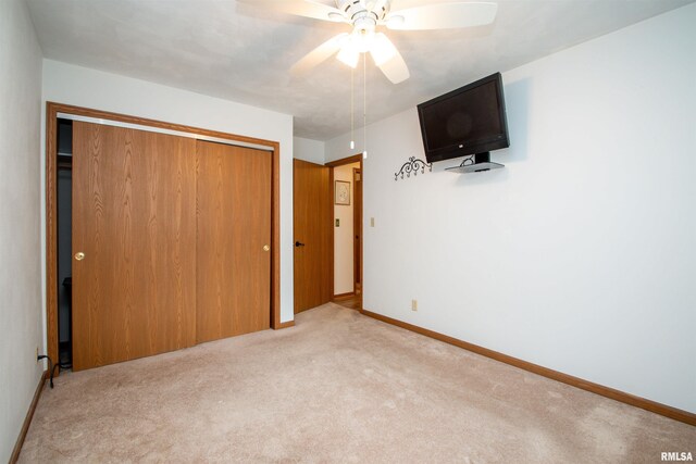 100 Oakridge Ct, Dahinda, IL 61428 - unfurnished bedroom with carpet flooring, a closet, and a ceiling fan