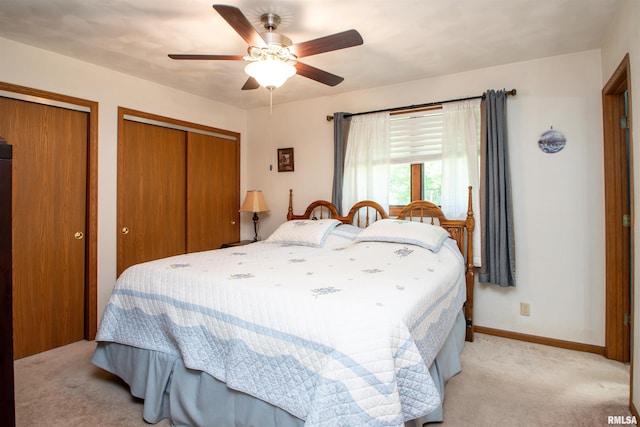 100 Oakridge Ct, Dahinda, IL 61428 - bedroom with light carpet, multiple closets, and ceiling fan