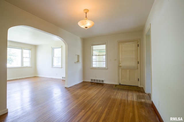 1030 E Euclid Ave, Peoria Heights, IL 61616 - spare room with arched walkways and wood-type flooring