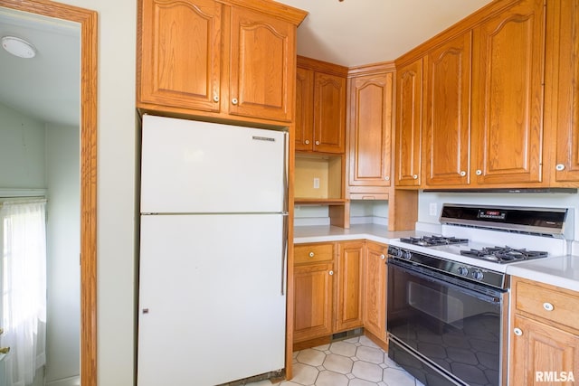 1030 E Euclid Ave, Peoria Heights, IL 61616 - kitchen featuring freestanding refrigerator, gas range, light countertops, and brown cabinetry