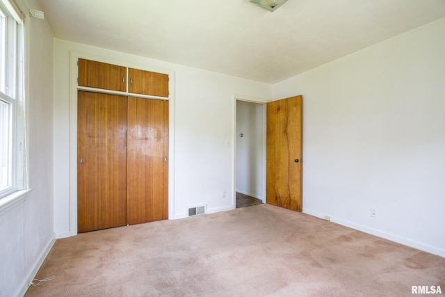 1030 E Euclid Ave, Peoria Heights, IL 61616 - unfurnished bedroom featuring a closet and carpet