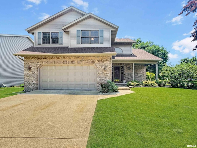125 Prairieview Dr, East Peoria, IL 61611 - view of front of house featuring concrete driveway, a front lawn, a garage, a shingled roof, and brick siding