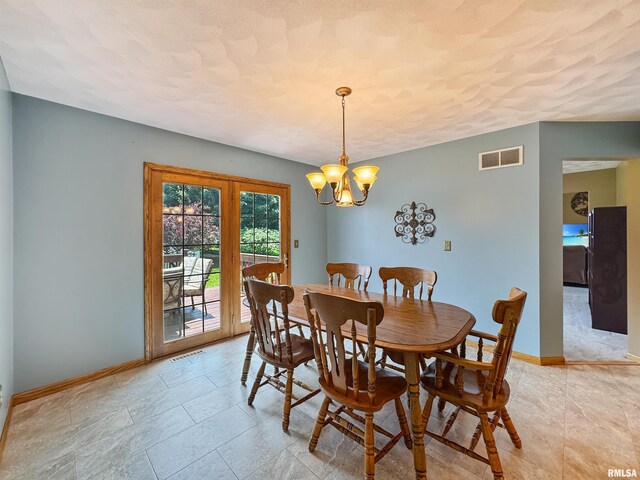 125 Prairieview Dr, East Peoria, IL 61611 - dining area with baseboards and a chandelier