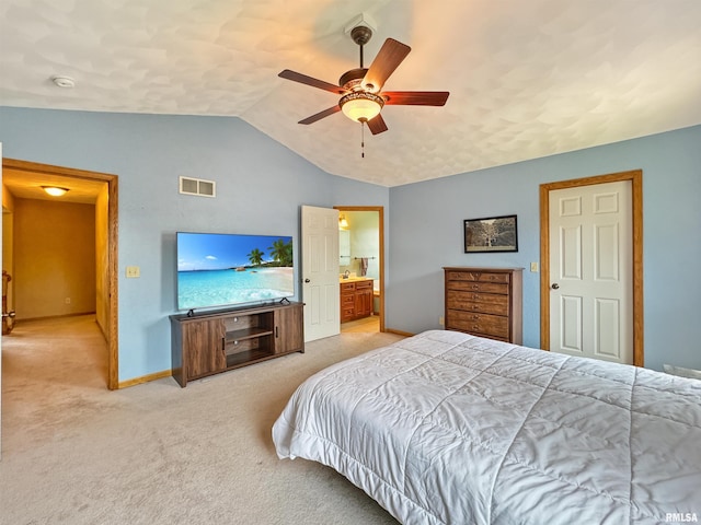 125 Prairieview Dr, East Peoria, IL 61611 - bedroom with lofted ceiling, light colored carpet, ceiling fan, and connected bathroom