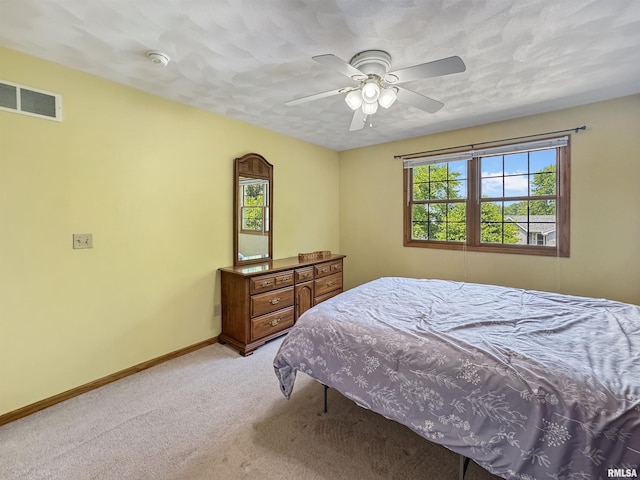 125 Prairieview Dr, East Peoria, IL 61611 - bedroom featuring multiple windows, light carpet, and ceiling fan