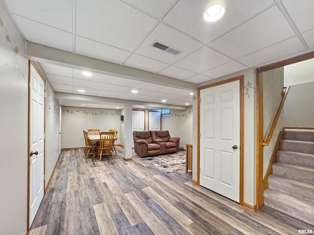 125 Prairieview Dr, East Peoria, IL 61611 - finished below grade area with wood finished floors, stairway, recessed lighting, and a drop ceiling