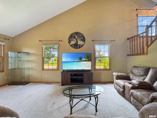 125 Prairieview Dr, East Peoria, IL 61611 - carpeted living room with high vaulted ceiling and plenty of natural light
