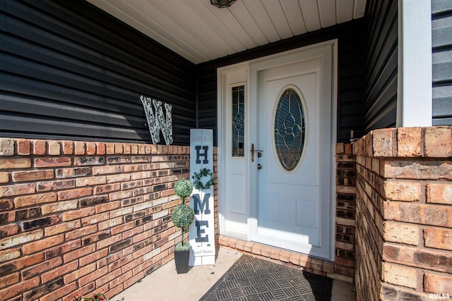 324 Pinecrest Dr, Germantown Hills, IL 61548 - property entrance featuring brick siding and covered porch