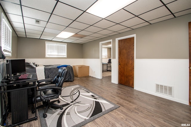 324 Pinecrest Dr, Germantown Hills, IL 61548 - office space featuring wood finished floors, a paneled ceiling, and a wainscoted wall