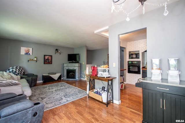 324 Pinecrest Dr, Germantown Hills, IL 61548 - living area with a fireplace and light wood-style flooring