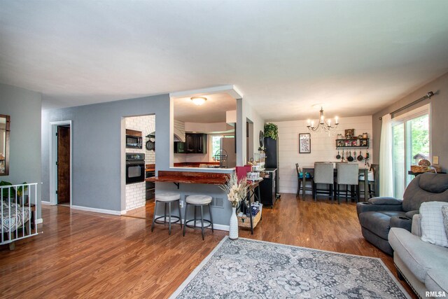 324 Pinecrest Dr, Germantown Hills, IL 61548 - living room with a chandelier and wood finished floors
