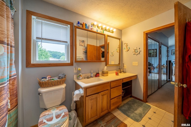 21501 N Berchtold Rd, Chillicothe, IL 61523 - bathroom with vanity and a textured ceiling
