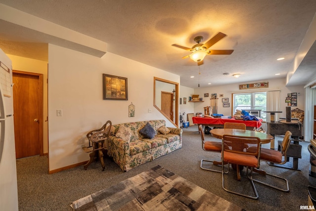 21501 N Berchtold Rd, Chillicothe, IL 61523 - living room with carpet, a textured ceiling, and ceiling fan