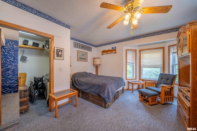21501 N Berchtold Rd, Chillicothe, IL 61523 - bedroom featuring dark carpet, a ceiling fan, and a closet