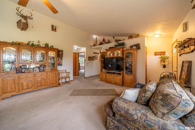 21501 N Berchtold Rd, Chillicothe, IL 61523 - living room featuring vaulted ceiling, light carpet, and ceiling fan