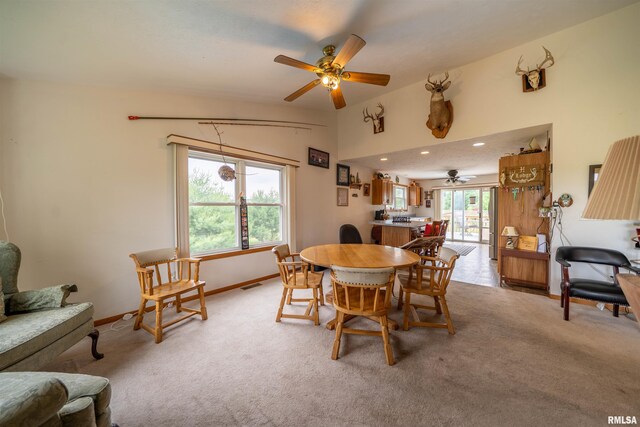 21501 N Berchtold Rd, Chillicothe, IL 61523 - dining space with a ceiling fan, light colored carpet, and vaulted ceiling