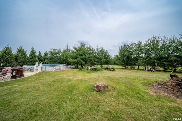 21501 N Berchtold Rd, Chillicothe, IL 61523 - view of grassy yard with an outdoor pool