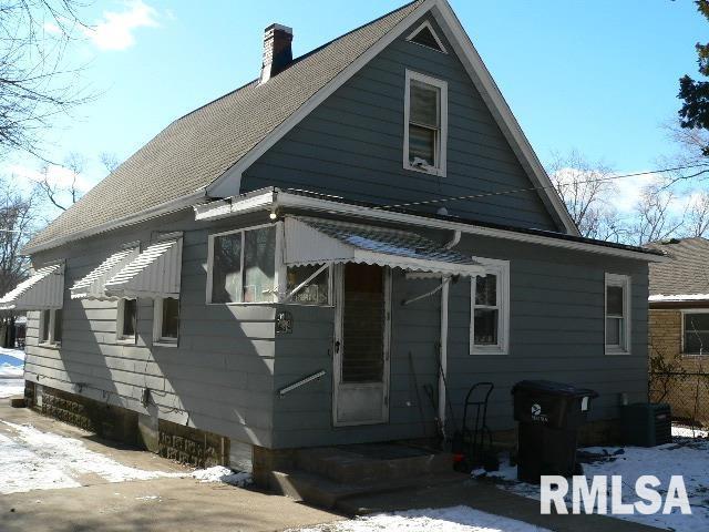 2803 W Fremont St, Peoria, IL 61605 - snow covered back of property with a chimney