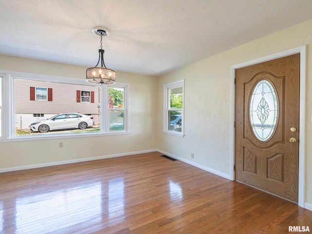 621 E Sciota Ave, Peoria Heights, IL 61616 - foyer with a chandelier and wood finished floors