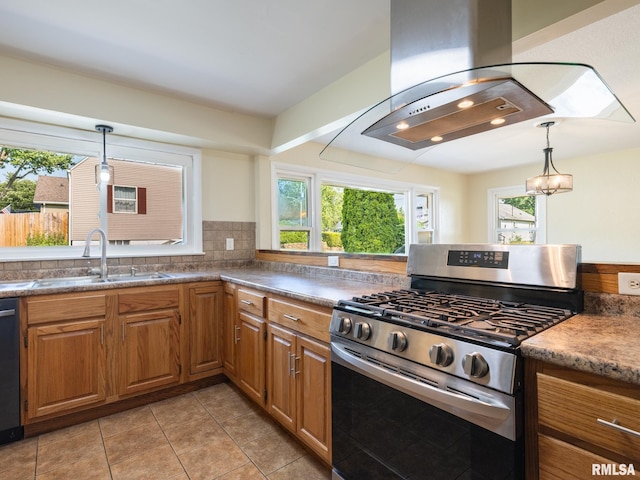 621 E Sciota Ave, Peoria Heights, IL 61616 - kitchen with gas range, island range hood, brown cabinetry, light tile patterned floors, and hanging light fixtures