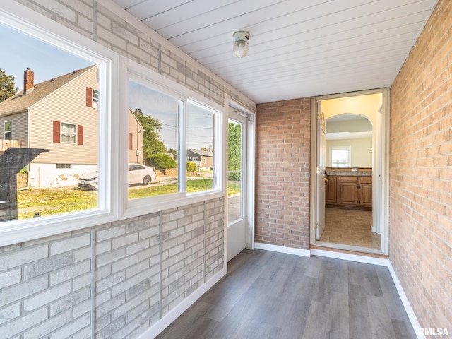 621 E Sciota Ave, Peoria Heights, IL 61616 - unfurnished sunroom with arched walkways