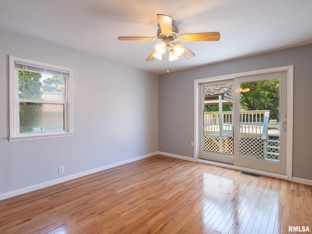 621 E Sciota Ave, Peoria Heights, IL 61616 - unfurnished room with plenty of natural light, light wood-style flooring, and a ceiling fan