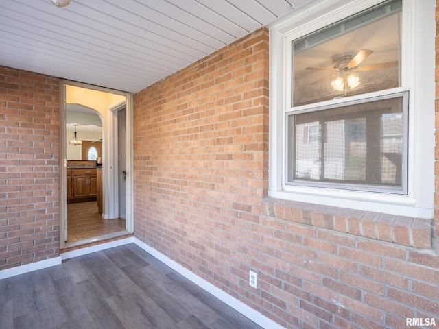 621 E Sciota Ave, Peoria Heights, IL 61616 - unfurnished sunroom with arched walkways and a ceiling fan