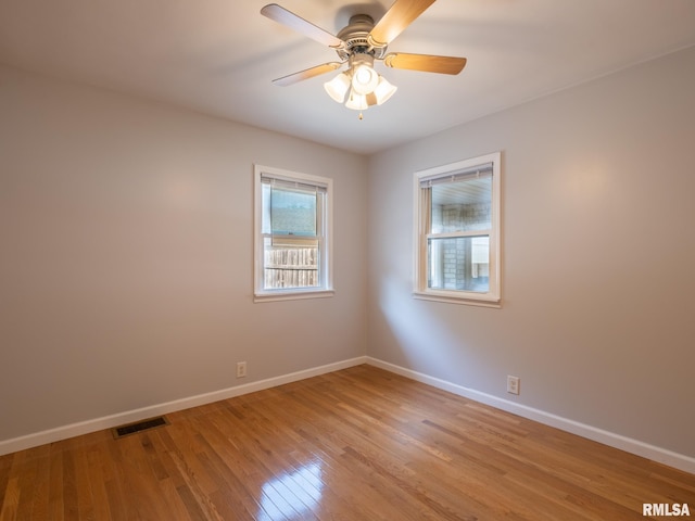 621 E Sciota Ave, Peoria Heights, IL 61616 - unfurnished room with light wood finished floors and ceiling fan