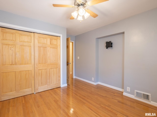 621 E Sciota Ave, Peoria Heights, IL 61616 - unfurnished bedroom with wood finished floors, a closet, and ceiling fan