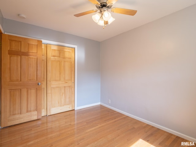 621 E Sciota Ave, Peoria Heights, IL 61616 - unfurnished bedroom featuring light wood-type flooring, a closet, and ceiling fan