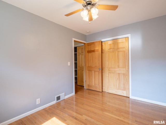 621 E Sciota Ave, Peoria Heights, IL 61616 - unfurnished bedroom with light wood-style flooring, a closet, and ceiling fan