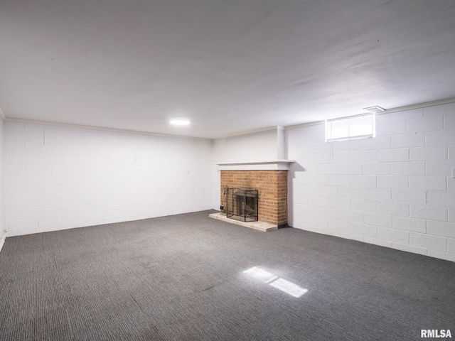 621 E Sciota Ave, Peoria Heights, IL 61616 - below grade area featuring a brick fireplace, carpet flooring, and concrete block wall