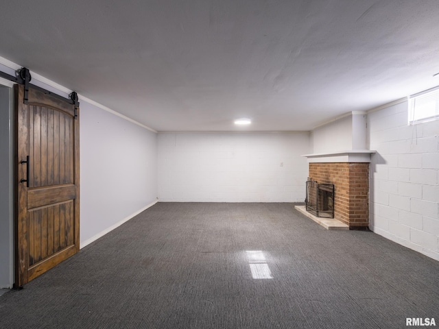 621 E Sciota Ave, Peoria Heights, IL 61616 - basement featuring concrete block wall, a brick fireplace, carpet floors, and a barn door
