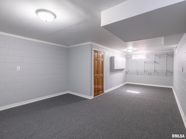 621 E Sciota Ave, Peoria Heights, IL 61616 - finished basement with dark carpet, crown molding, and concrete block wall