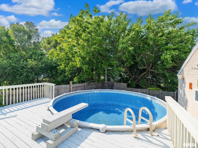 621 E Sciota Ave, Peoria Heights, IL 61616 - view of pool with a fenced backyard, a wooden deck, and view of wooded area