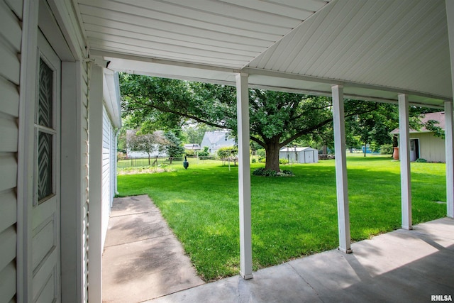 202 Esser St, Washington, IL 61571 - view of grassy yard featuring a storage shed