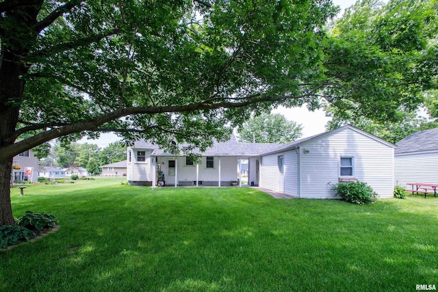 202 Esser St, Washington, IL 61571 - back of property with a yard and a shingled roof